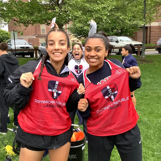 Dominican Republic Lacrosse players in red pinnies smiling